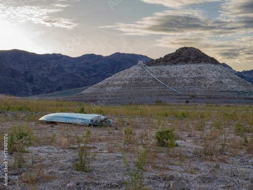 Sunken boat on dried up lake bed in Lake Mead