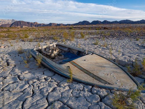 Sunken boat on dried up lake bed in Lake Mead