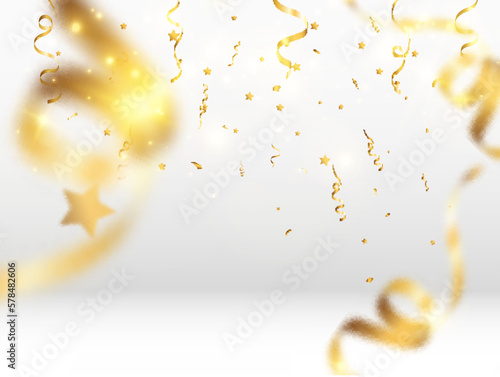   Golden confetti falls on a beautiful background. Falling streamers on stage. 