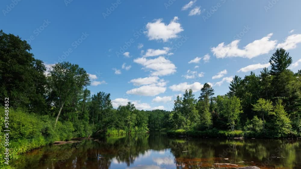 Time lapse of the clouds moving above Kettle River surrounded by forest in Minnesota. Time lapse of the clouds moving above Kettle River surrounded by forest in Minnesota.