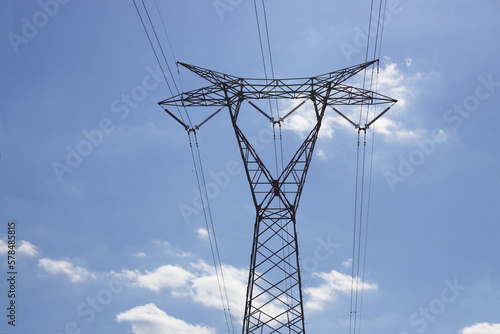 Wallpaper Mural View of a high voltage electrical transmission tower with sky with clouds in the background Torontodigital.ca