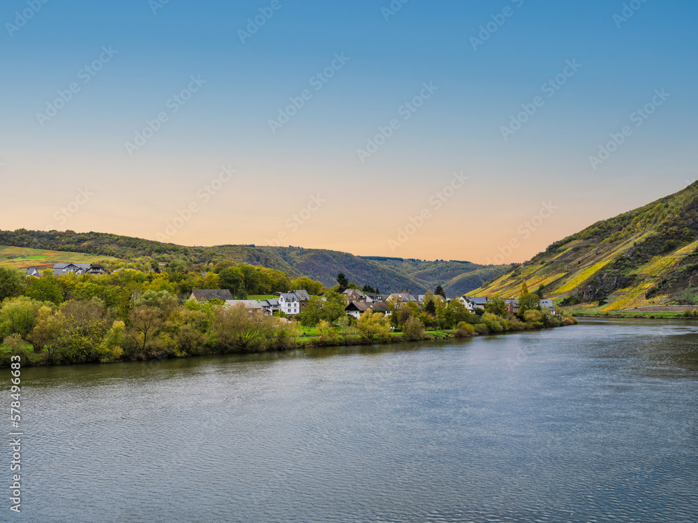 Senhals village on Moselle river bank during a clear sky afternoon in Cochem-Zell district, Germany
