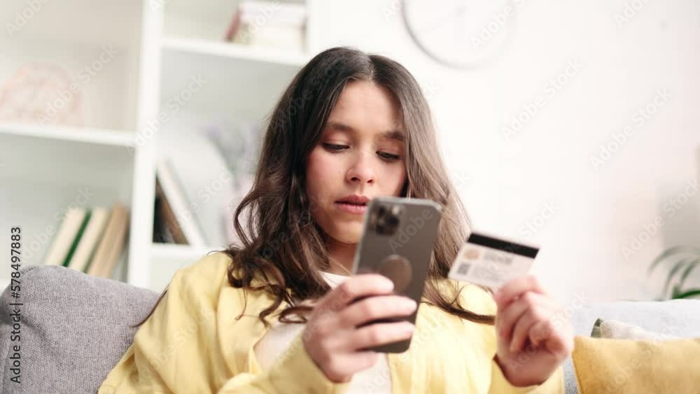 Portrait of young caucasian woman paying with credit card on laptop computer at home Happy customer doing payments online shopping in internet store and receiving cashback Easy pay concept Portrait of young caucasian woman paying with credit card on laptop computer at home Happy customer doing payments online shopping in internet store and receiving cashback Easy pay concept