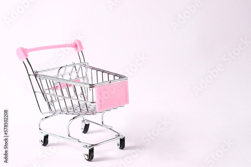 Mini shopping cart in white background