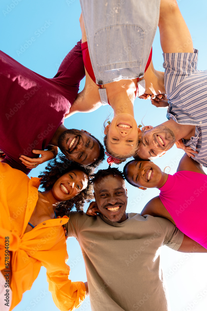Portrait of happy diverse friends embracing and smiling at beach, with copy space - obrazy, fototapety, plakaty 