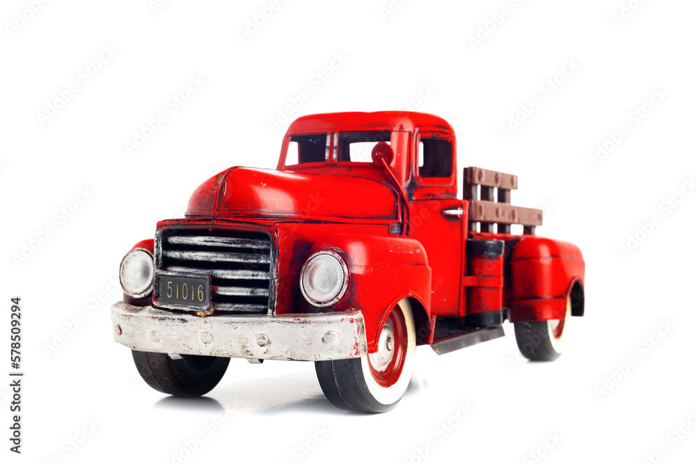 Red, vintage, toy truck isolated on white background. Old truck close-up.