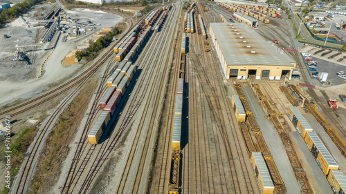 Schilderij op canvas Aerial view of train tracks, trains, cargos.