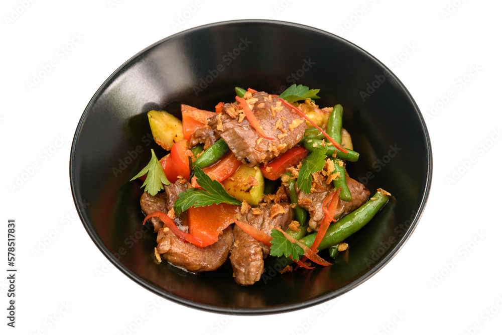Grilled beef with vegetables in a black plate Grilled beef with vegetables in a black plate