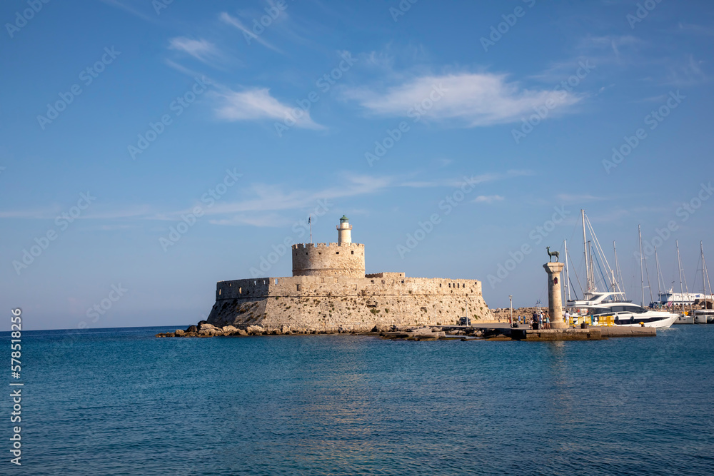 Landscape with Mandraki Harbour and two statues, Elefos and Elafina in Rhodes Island, Greece