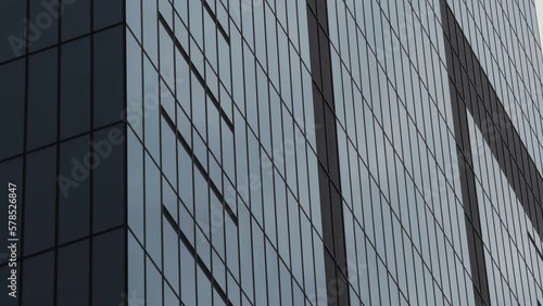 Wallpaper Mural Modern glass office skyscraper building. 4K video with windows texture of this corporation headquarters building. Torontodigital.ca