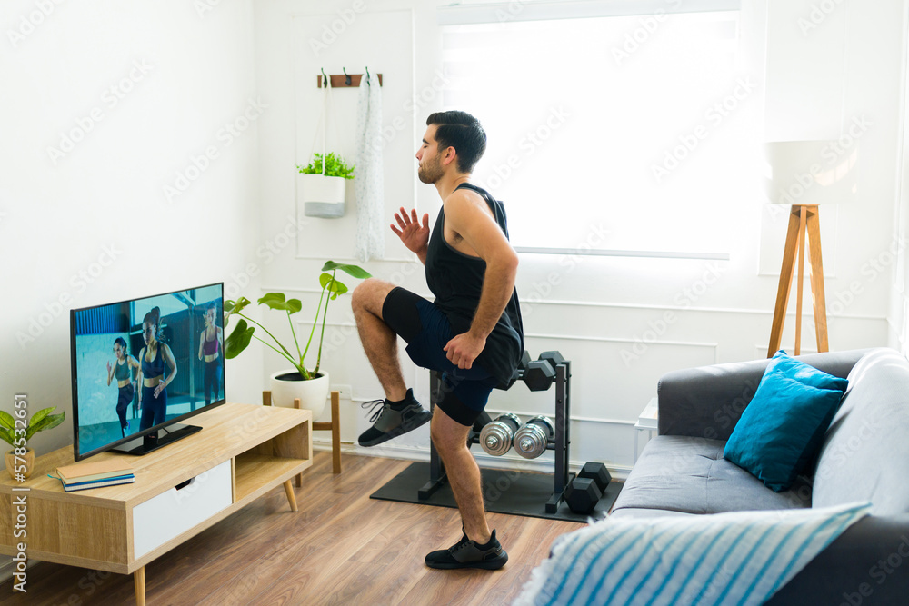Active man working out with cardio and running at home Active man working out with cardio and running at home