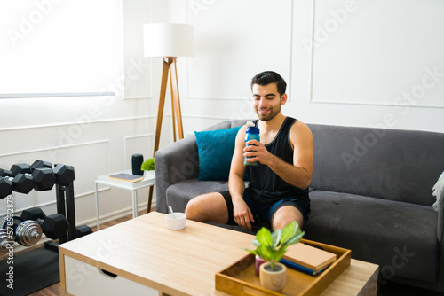 Happy fit man drinking a healthy protein shake © AntonioDiaz