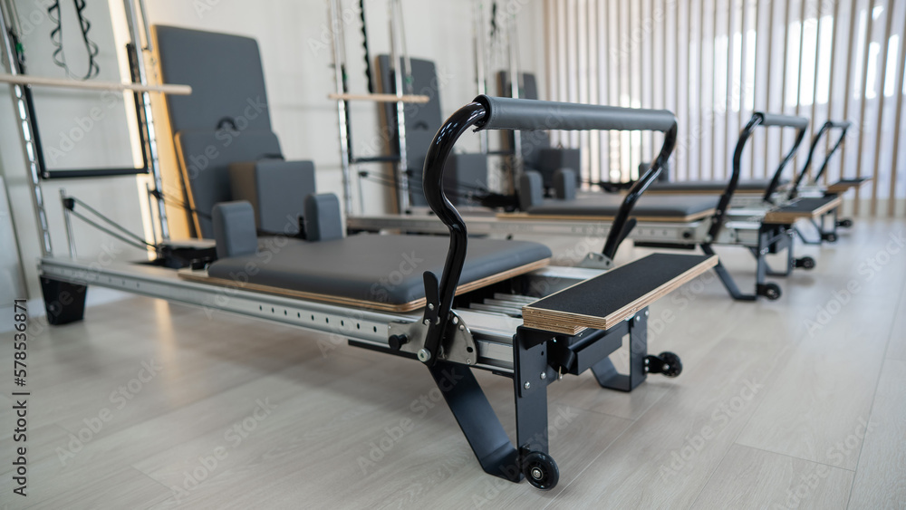 Two reformer machines. Pilates studio without people. 