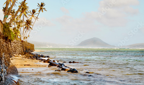 Kahala coastline on the island of Oahu, Hawaii with Koko Head Crater in background photo