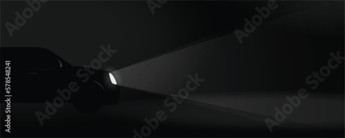 Backdrop banner of Black SUV car with the lights ON enlightening the darkness of the lonely unknown road ahead