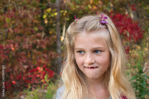 portrait of a little girl smiling outside