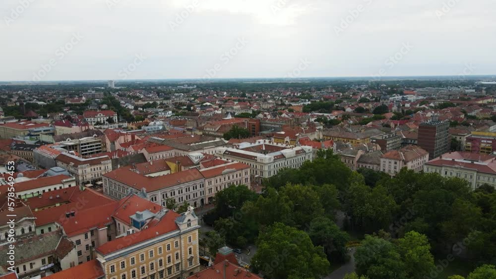 Flyover above red roofed buildings of Szeged, Hungary. Aerial view. Flyover above red roofed buildings of Szeged, Hungary. Aerial view.