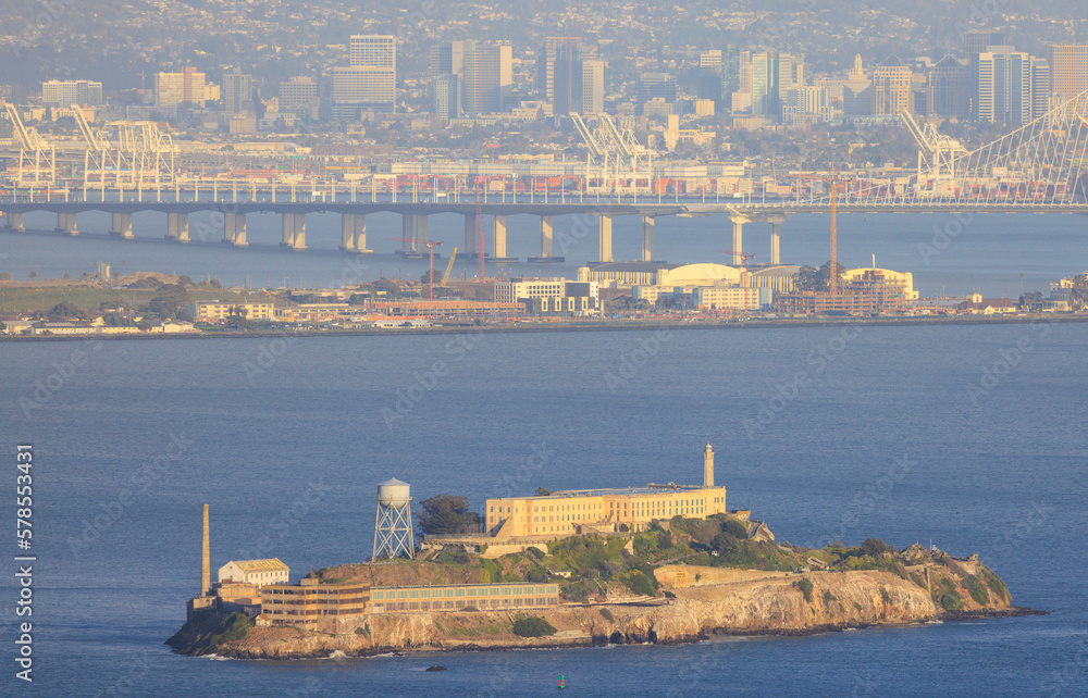 Alcatraz Island in San Francisco Bay with Bay Bridge and Oakland in background