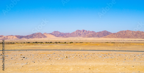 Namib Desert Safari with sand dune in Namibia, South Africa. Natural landscape background at sunset. Famous tourist attraction. Sand in Grand Canyon photo