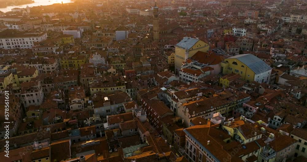 Flying Over Red-Roofed Structures In The Historical City Of Venice, Italy During Sunset. Aerial Drone Shot Flying Over Red-Roofed Structures In The Historical City Of Venice, Italy During Sunset. Aerial Drone Shot