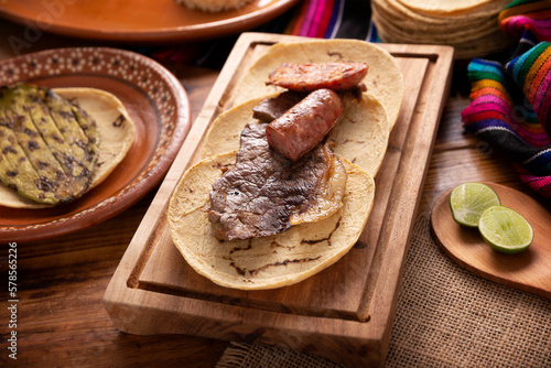 Carne Asada. (roast meat) very popular dish in northern Mexico, also called Asado, Discada or Parrillada, is a cooking technique in which food is exposed to the heat of the embers. photo