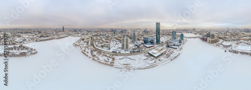 Yekaterinburg city with Buildings of Regional Government and Parliament, Dramatic Theatre, Iset Tower, Yeltsin Center, panoramic view at winter sunset.