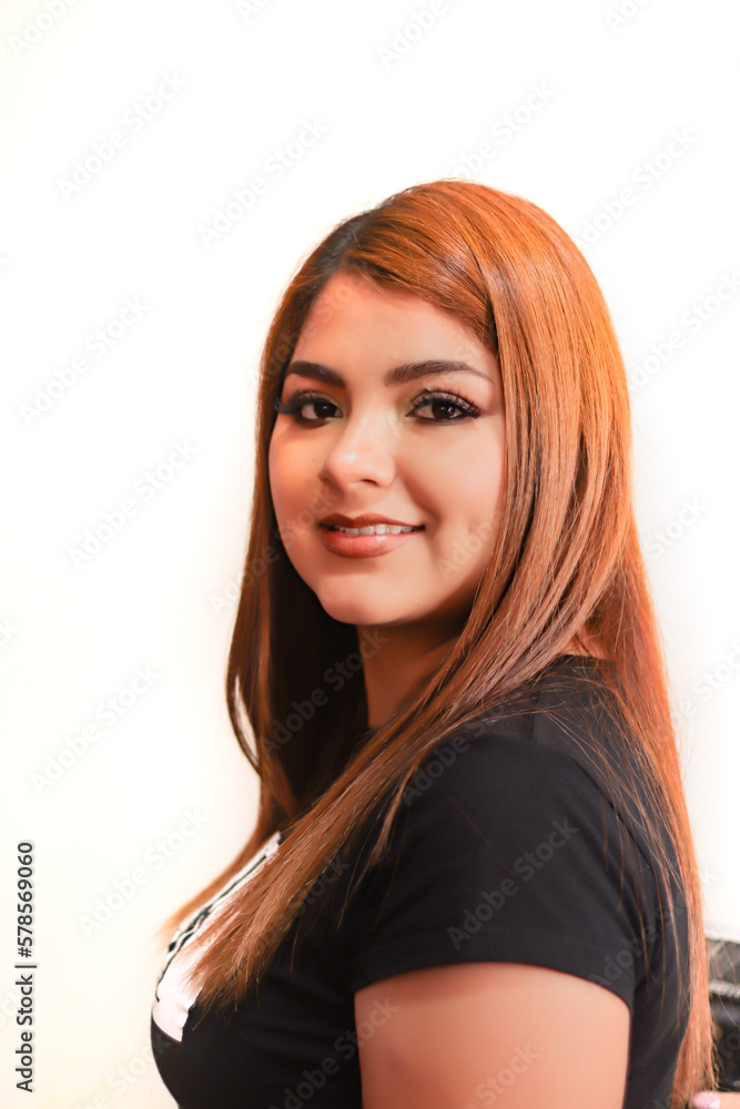 Naklejka premium Pretty, young woman, smiling, with straight, red hair.