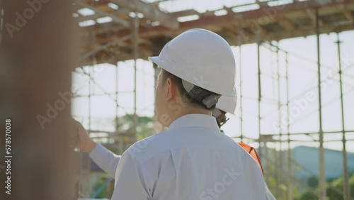 Two Engineers working on a construction site.