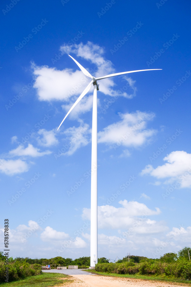 A large white wind turbine in Thailand. Alternative energy concepts, clean energy and wind energy.