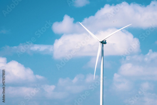 A large white wind turbine in Thailand. Alternative energy concepts, clean energy and wind energy.