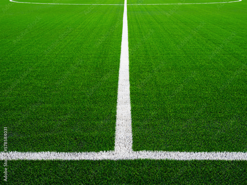 Obraz premium Football field of artificial grass. White line on the soccer green field.