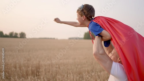 Father man son boy superman. Parent dad having fun to play with little kid child son in happy family activity lifestyle together summer day wheat field sunset, Concept win success winner hero victory