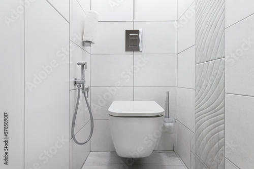 Modern white toilet with toilet and hygienic shower photo