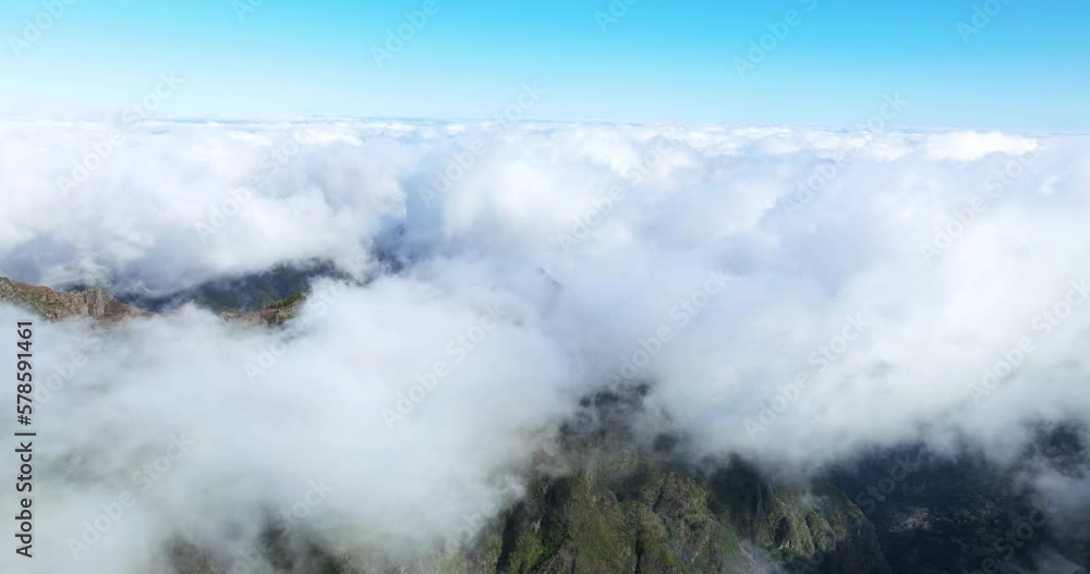 Low Clouds Over Pico Do Arieiro Mountain Peak In Madeira Island, Portugal. Aerial Shot Low Clouds Over Pico Do Arieiro Mountain Peak In Madeira Island, Portugal. Aerial Shot