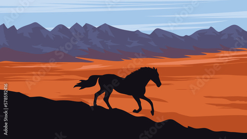 a horse is walking across a hill   desert  a mountain range