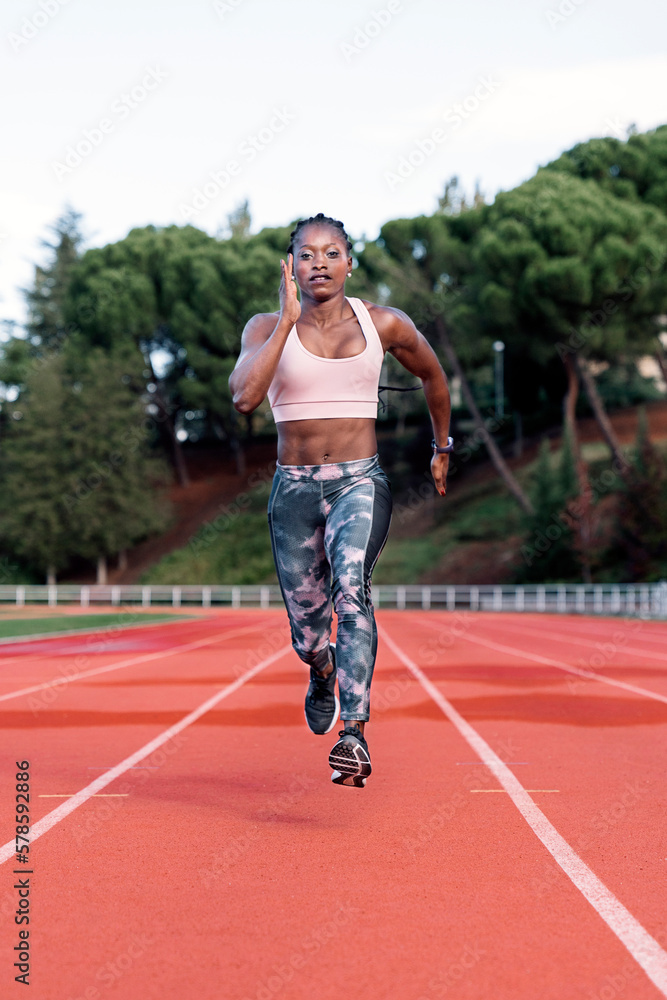 Athlete woman sprinter running in track