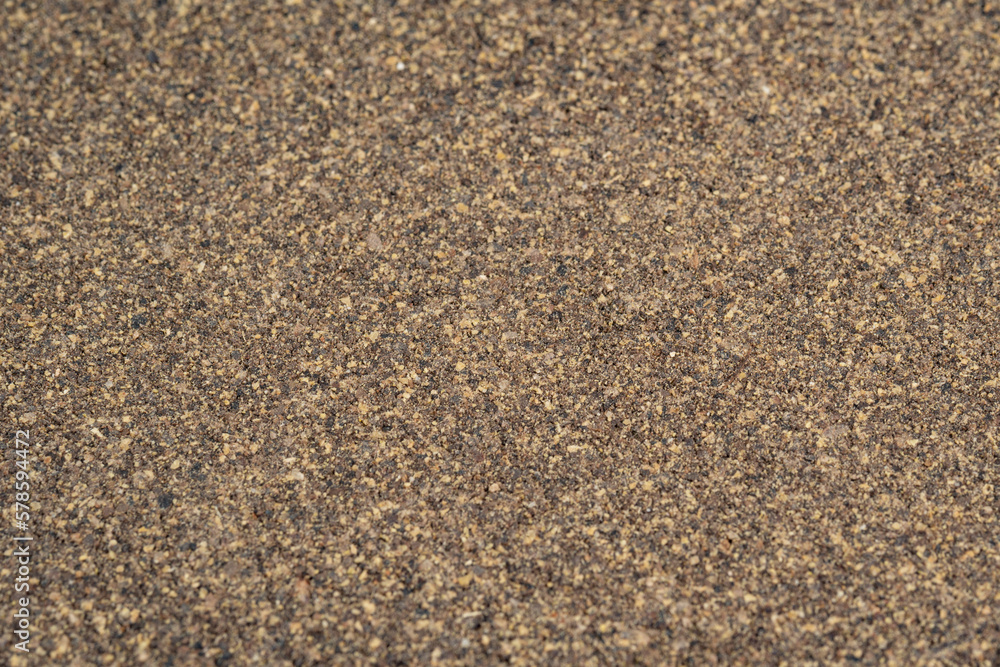 Poured ground black pepper background. Dry seasoning pepper. Spices and herbs for cooking, pepper powder Poured ground black pepper background. Dry seasoning pepper. Spices and herbs for cooking, pepper powder