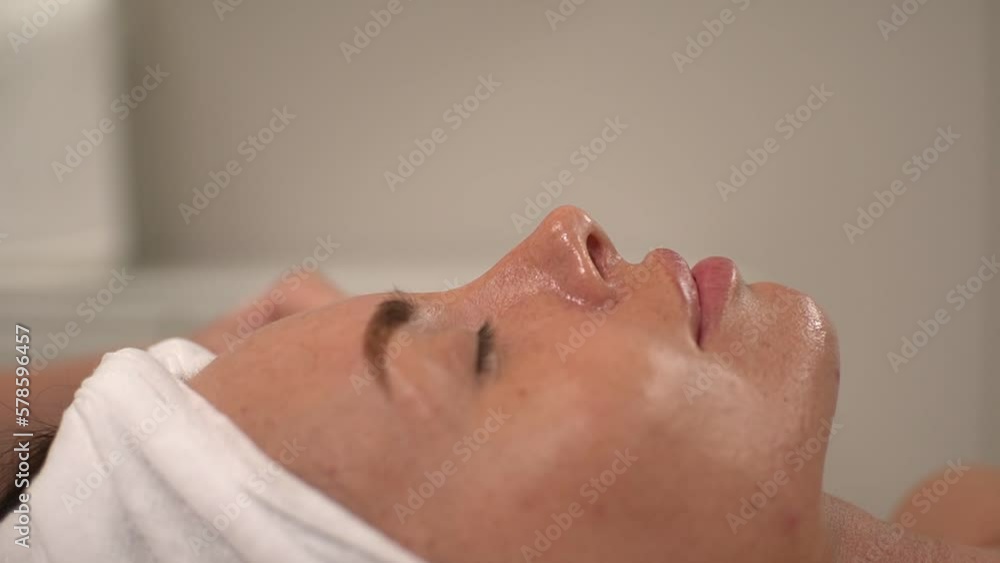 master woman performs the procedure using a microcurrent apparatus for facial skin. close-up face. real time video. High quality Full HD video recording master woman performs the procedure using a microcurrent apparatus for facial skin. close-up face. real time video. High quality Full HD video recording