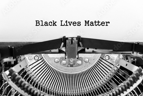 Black Lives Matter phrase closeup being typing and centered on a sheet of paper on old vintage typewriter mechanical