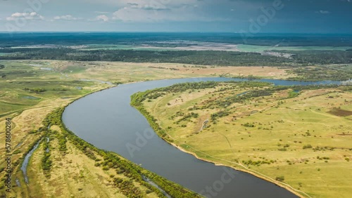 Rechytsa, Gomel Region, Belarus. Aerial View Of Dnieper River. Sky Above Green Meadow And River Landscape. Top View Of European Nature From High Attitude In Summer. Bird's Eye View. Dronelapse photo