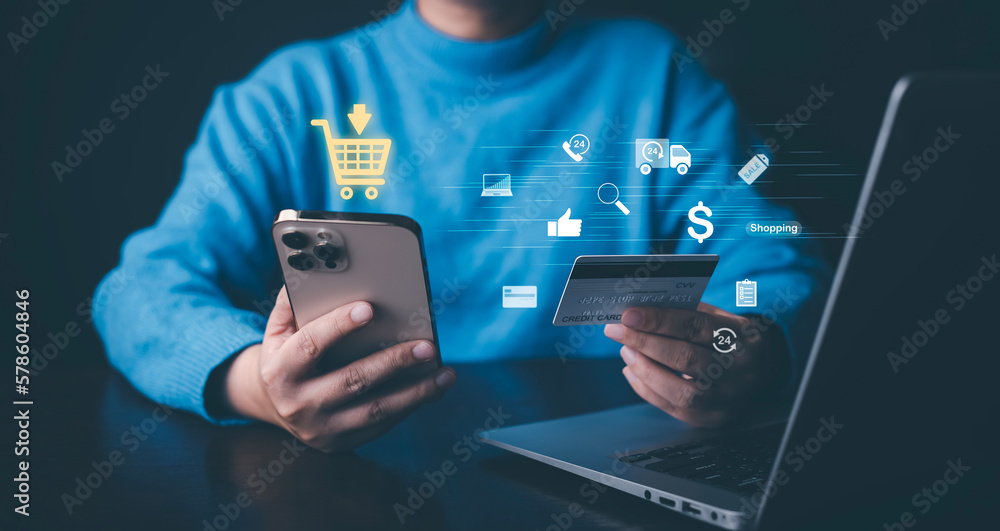 Smartphones with online shopping concepts, marketplace websites with the virtual interface of online Shopping cart part of the network, and Online shopping businesses with selecting shopping cart. - obrazy, fototapety, plakaty 
