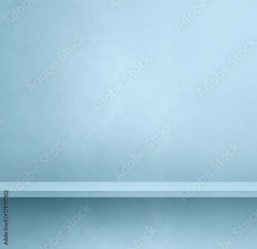 Empty shelf on a light blue concrete wall. Background template. Square mockup