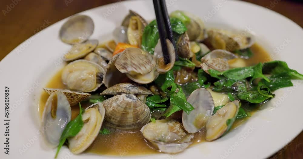Fry clam with basil in restaurant Fry clam with basil in restaurant