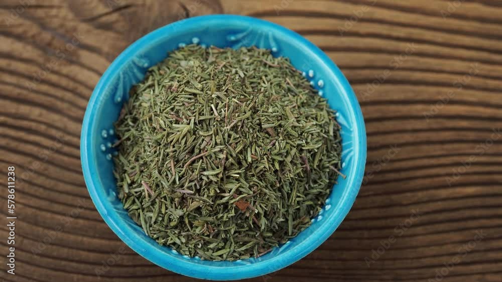Dry thyme for food in a small bowl on the table Dry thyme for food in a small bowl on the table