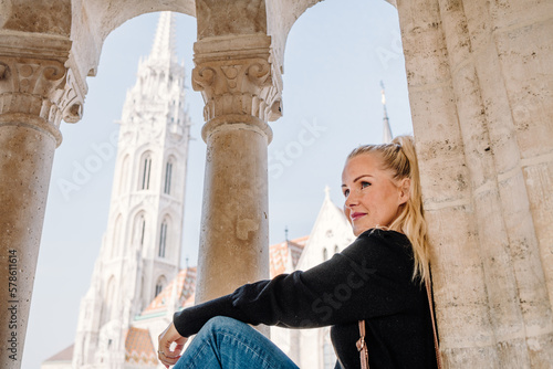 Blond woman sitting in a window by Matthias Church