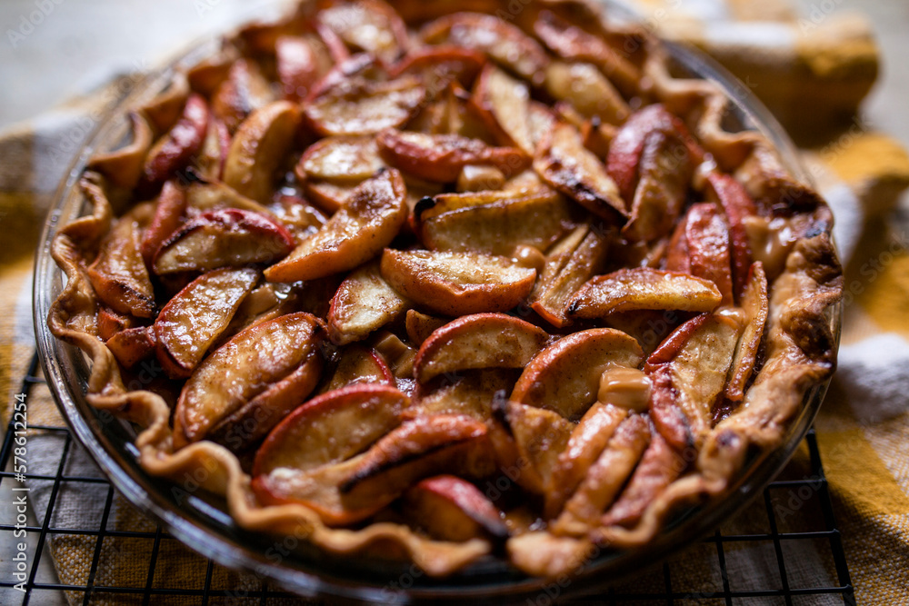 Warm apple pie cooling on wire rack on table Warm apple pie cooling on wire rack on table