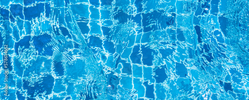 summer background, swimming pool bottom ripple and flow with waves background. blue sea water, texture of water surface..