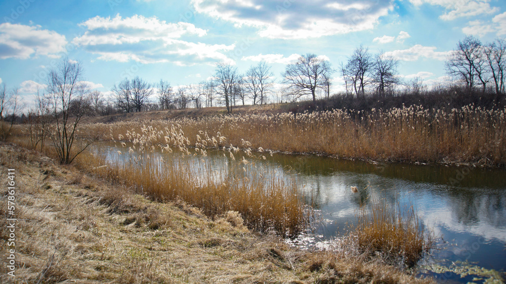 River in the village, clouds