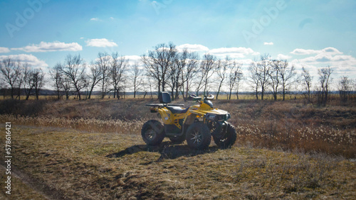 The quad bike is standing in the field