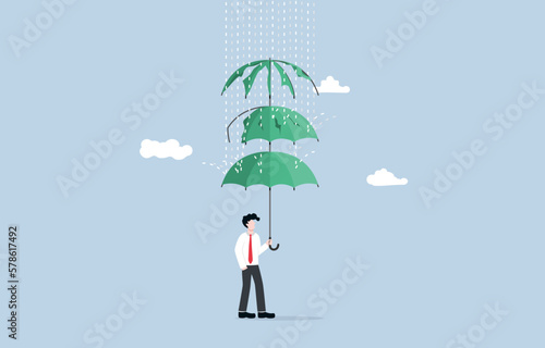 Having various business protection plans, operations against potential risks and uncertainties, insurance policy concept, Businessman spreading multi layer umbrella to cover rain.